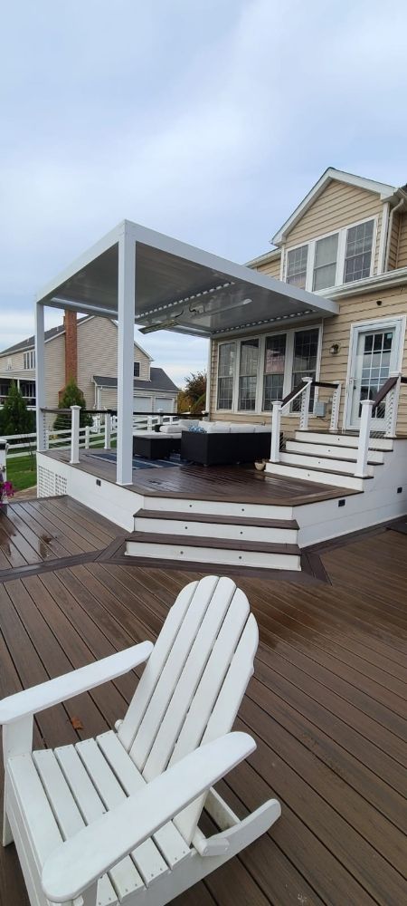 Two-story deck with stairs and white railings